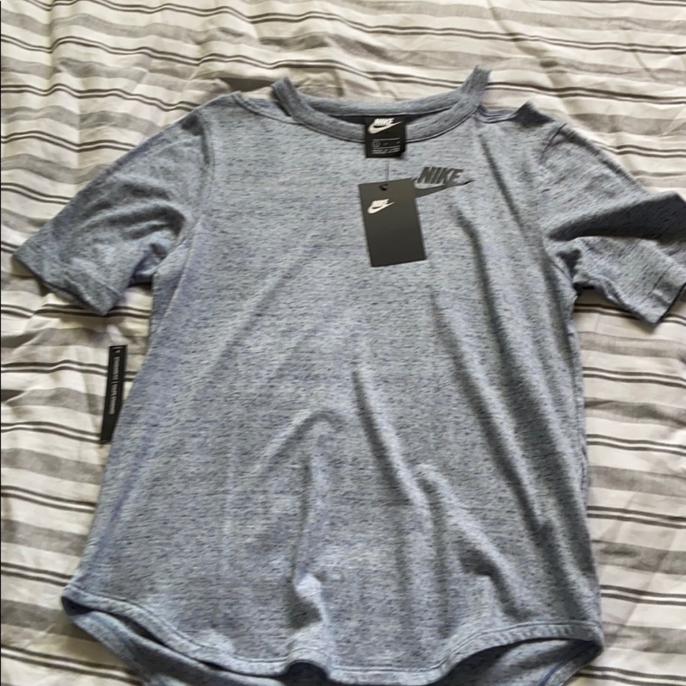Dark blue nike tee shirt with open shoulders.